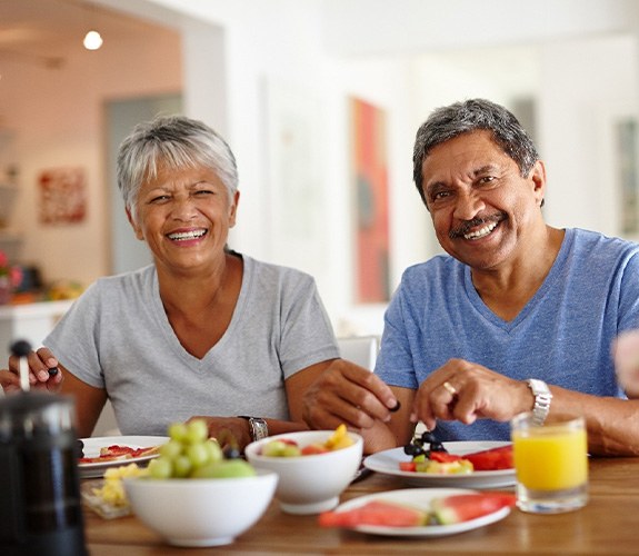 Couple eating healthy foods for dinner