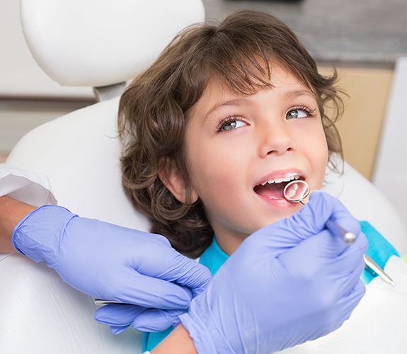 Young child receiving children's dentistry checkup