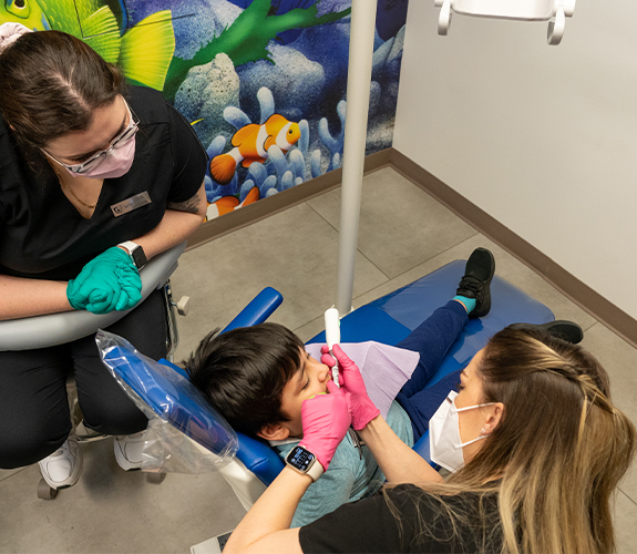 Child receiving dental sealants