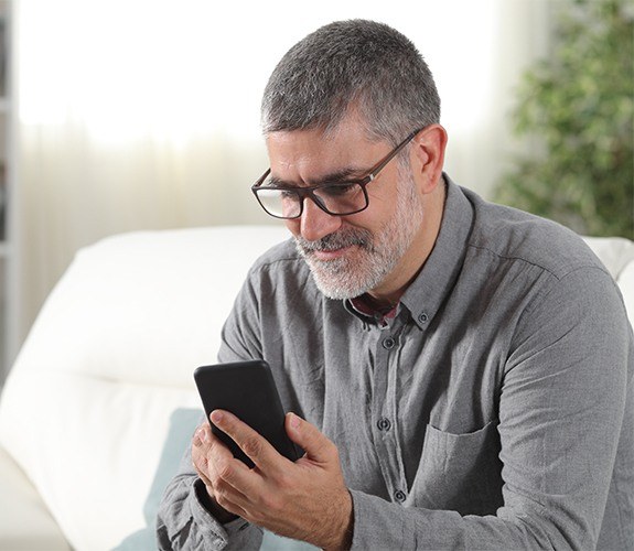 Middle aged man talking on the phone