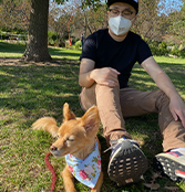 Doctor Liang with his dog at the park