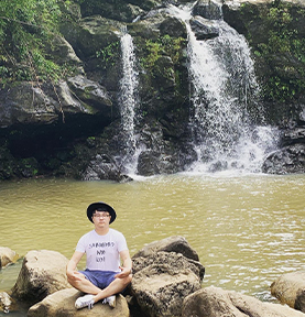 Doctor Liang at a waterfall