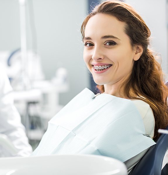 Woman with braces in orthodontist's chair