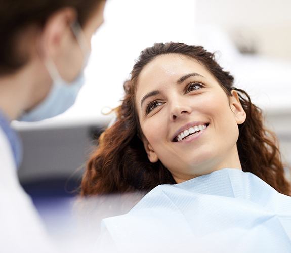 Female dental patient with dental implants in Channahon, IL