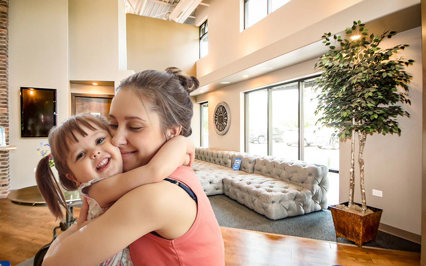 Mother and daughter smiling in their Channahon Illnois dental office