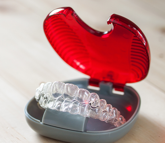 Set of Invisalign clear braces in carrying case