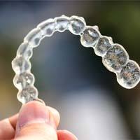 Closeup of Clear Aligners in Channahon on colorful background