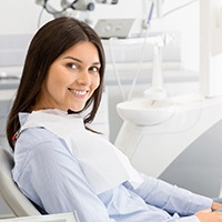 Smiling patient leaning back in chair before orthodontics in Channahon, IL
