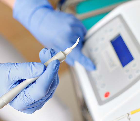 Patient receiving soft tissue laser dentistry treatment