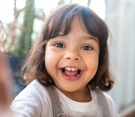 Young girl smiling before appointment for Phase 1 orthodontics in Channahon, IL