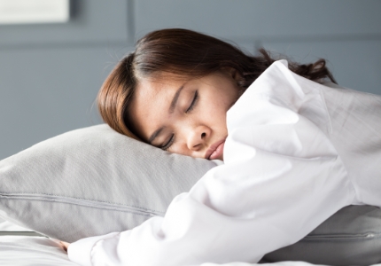 Woman sleeping soundly thanks to sleep apnea therapy