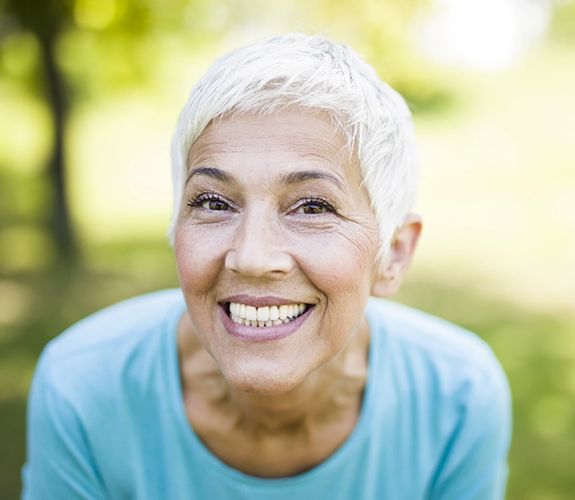 Woman after soft tissue gum disease therapy in Channahon