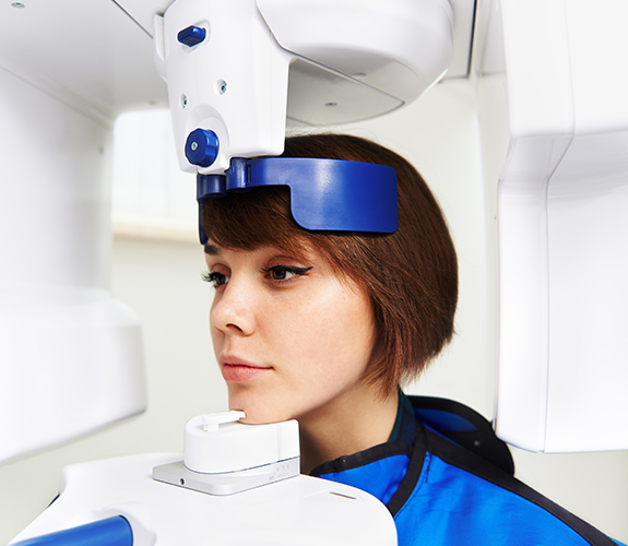 Dental patient receiving C T Cone beam digital x-ray scan