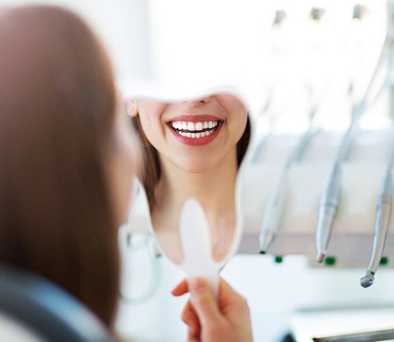 Woman visiting her dentist to maintain her results
