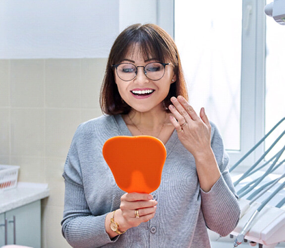woman pleased with whitening results