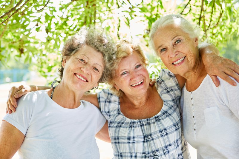 women with dental implants