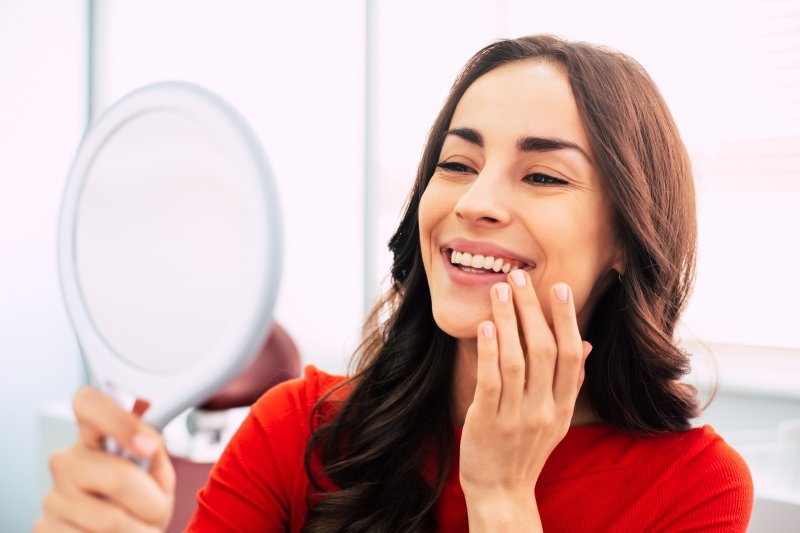 woman smiling after cosmetic dentistry