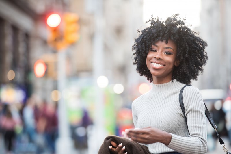 young woman smiling in the city