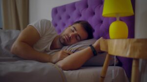 Man asleep in his bed